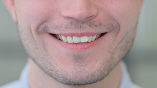 istock Close up of Smiling Young Man 1325262549