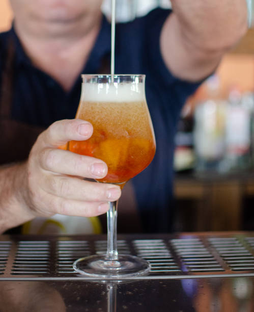 istock waiter filling a lager beer from tap 1325263107