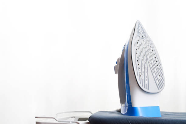 istock Blue irons are readily available at the laundry. 1325263711