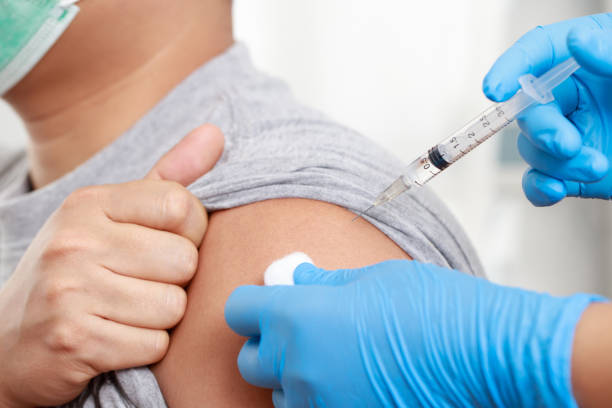 istock man is vaccinated against COVID-19 to build immunity. 1325263898