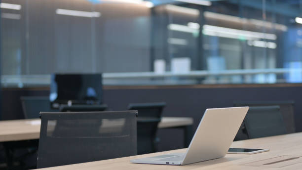 istock Woman Closing Laptop Standing up Going Away 1325263987