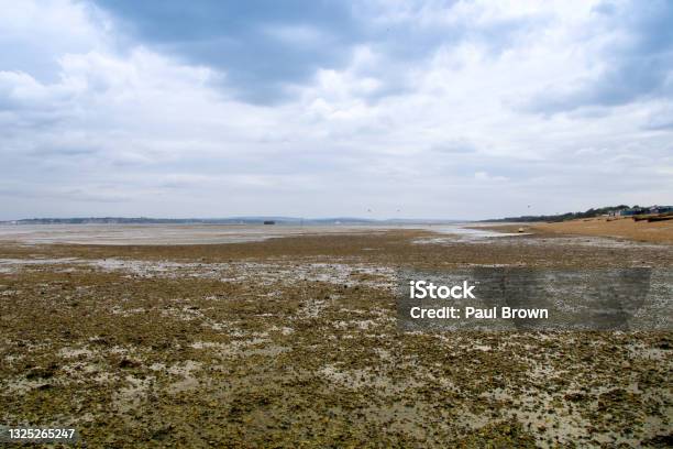 Calshot Beach At Low Tide Stock Photo - Download Image Now - Beach, The Solent, Cloud - Sky