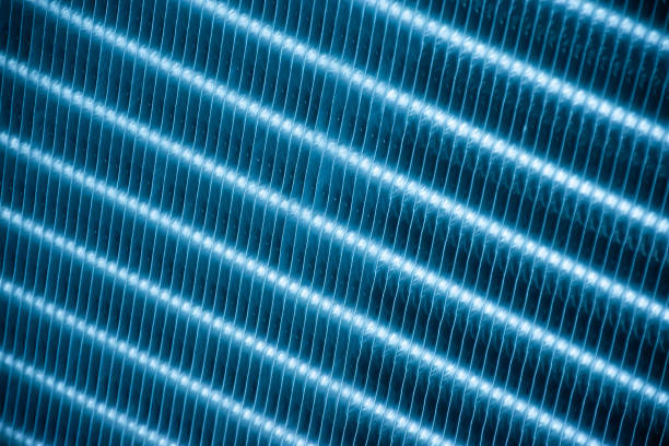 Close up aluminum fin of cooling condenser coil of air condition system. Pattern for abstract background. stock photo