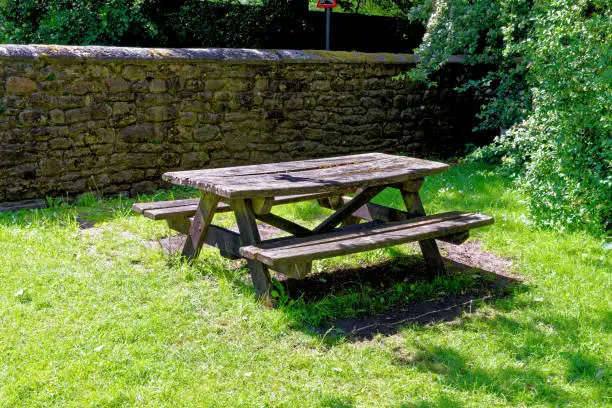 Shaded woodland picnic area with table and bench seats - Beamish, Durham County, England, United Kingdom