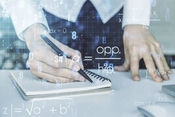 istock Creative scientific formula concept with hand writing in notebook on background with laptop. Multiexposure 1325269331