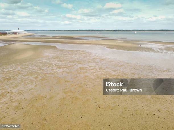 Low Tide At Calshot Hampshire Stock Photo - Download Image Now - Beach, Beauty In Nature, Coastline