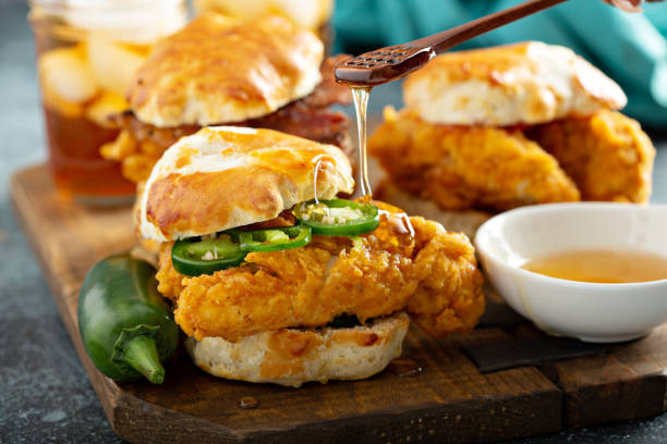 Breakfast biscuit sandwiches with fried chicken Breakfast biscuit sandwiches with fried chicken, traditional southern food hot breakfast stock pictures, royalty-free photos & images