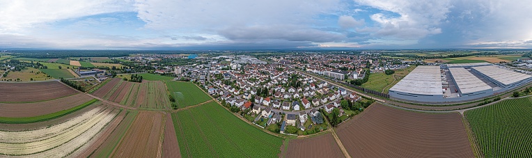 Drone panorama of German district town Gross-Gerau in south Hesse in the evening against cloudy sky in summer