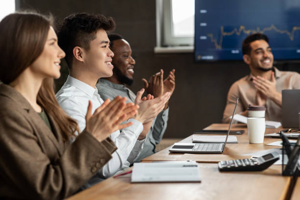 istock Successful Meeting. Colleagues having training in boardroom, clapping hands 1325278569