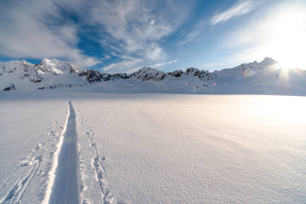 istock View of backcountry ski track in deep snow 1325280891