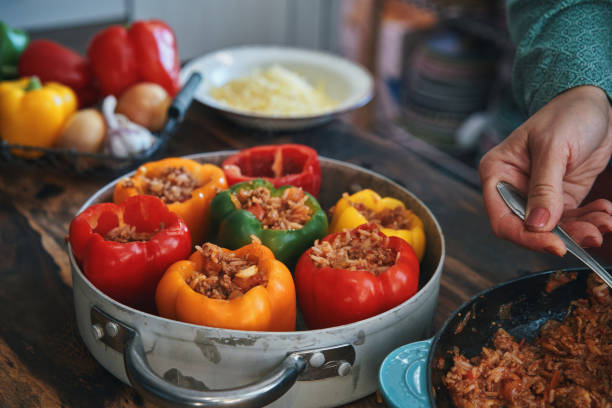 istock Preparing Stuffed Bell Peppers with Ground Meat in Tomato Sauce 1325281774