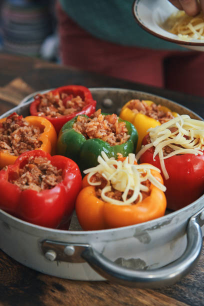 istock Preparing Stuffed Bell Peppers with Ground Meat in Tomato Sauce 1325281998