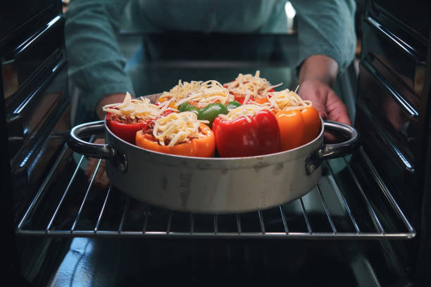 Preparing Stuffed Bell Peppers with Ground Meat in Tomato Sauce