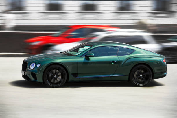 Luxury British Bentley Continental GT car in motion. Blurred car. Supercar at high speed stock photo