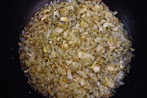 istock Chopped onions on a board - fried onion 1325283462