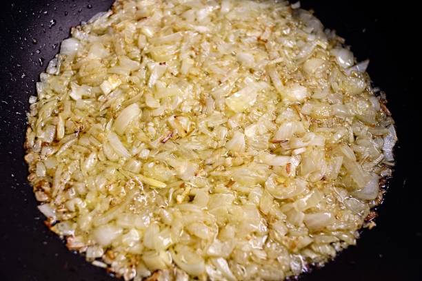 istock fried onion - Chopped onions on a board 1325283561