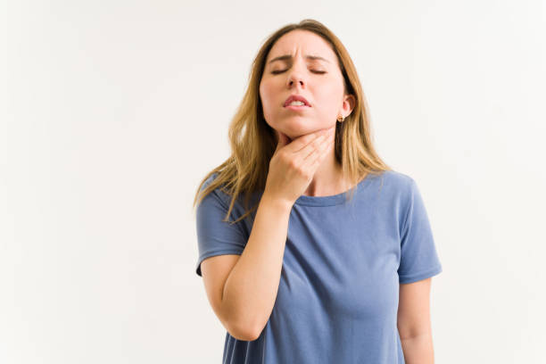 caucasian woman with reflux and indigestion - boğaz ağrısı stok fotoğraflar ve resimler