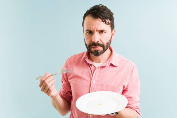 istock Portrait of a guy losing his appetite 1325286479