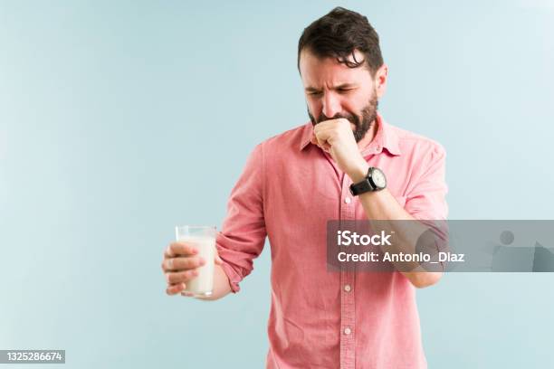 Latin Man Feeling Unwell With Nausea Stock Photo - Download Image Now - Lactose Fermentation, Milk, Men