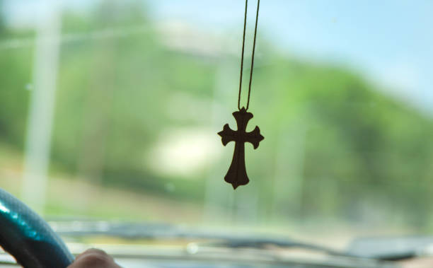 istock cross necklace in the car 1325287507