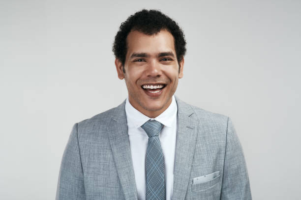 istock Studio shot of a confident businessman standing against a grey background 1325290105
