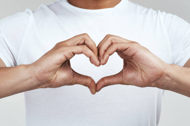 istock Shot of an unrecognizable man forming a heart shape with his hands 1325290158