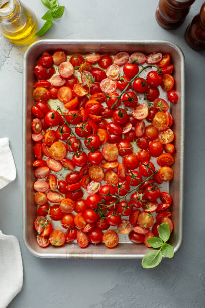 istock Cherry tomatoes with garlic and spices on a tray 1325291203