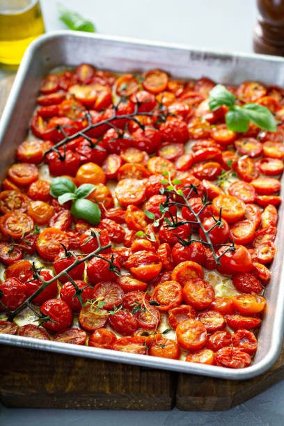 istock Cherry tomatoes roasted with garlic and spices on a tray 1325291209