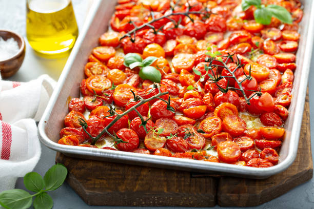 istock Cherry tomatoes roasted with garlic and spices on a tray 1325291219