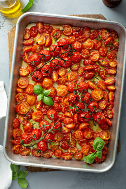 istock Cherry tomatoes roasted with garlic and spices on a tray 1325291224