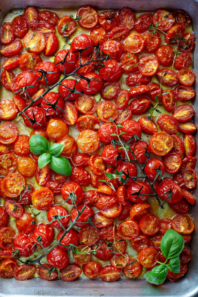 istock Cherry tomatoes roasted with garlic and spices on a tray 1325291241