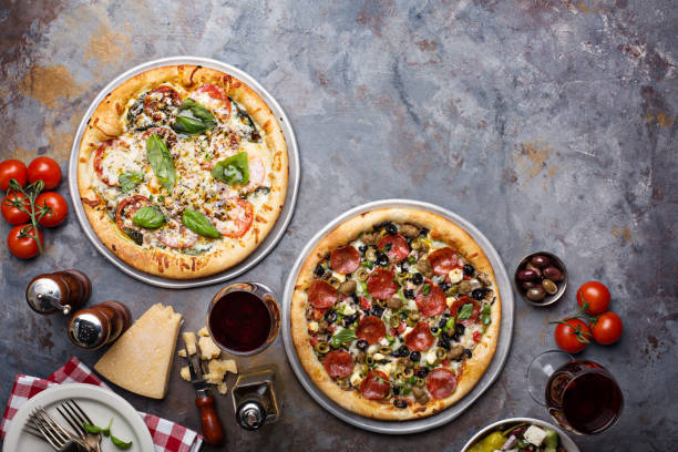 istock Pizza Margarita and Pepperoni with garnishes 1325291268