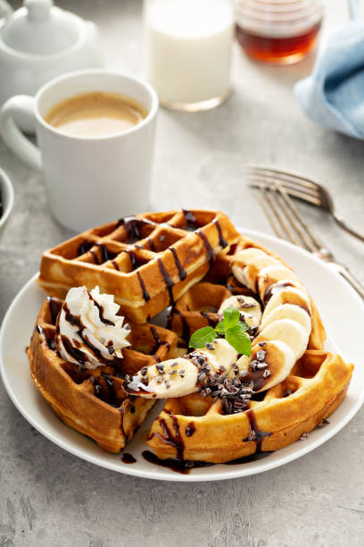 istock Breakfast waffles with bananas and chocolate 1325291303