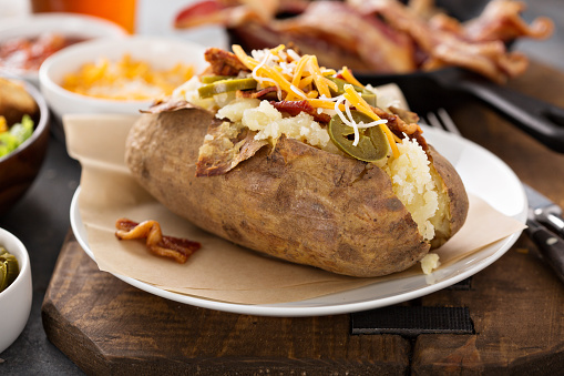 istock Fully loaded baked potato with all the toppings 1325291313