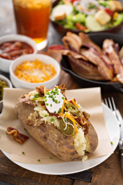 istock Fully loaded baked potato with all the toppings 1325291314