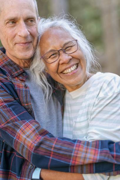 istock Happy senior couple on vacation hiking 1325292447