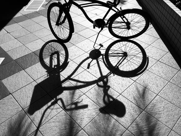 Shadow of a parked bicycle.