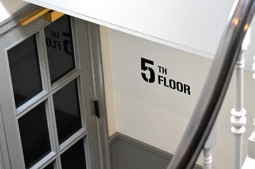 5th floor sign at staircase.
