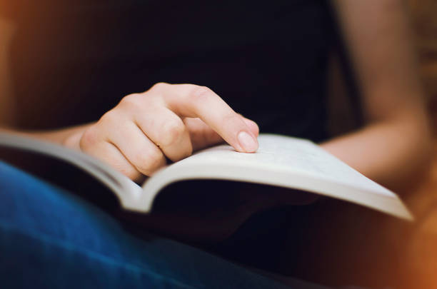 Girl reads a book, close-up. Girl reads a book, close-up. literacy photos stock pictures, royalty-free photos & images
