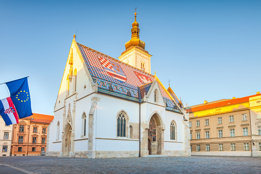 St Mark's Square with St Mark's Church in Zagreb, Croatia at sunset.