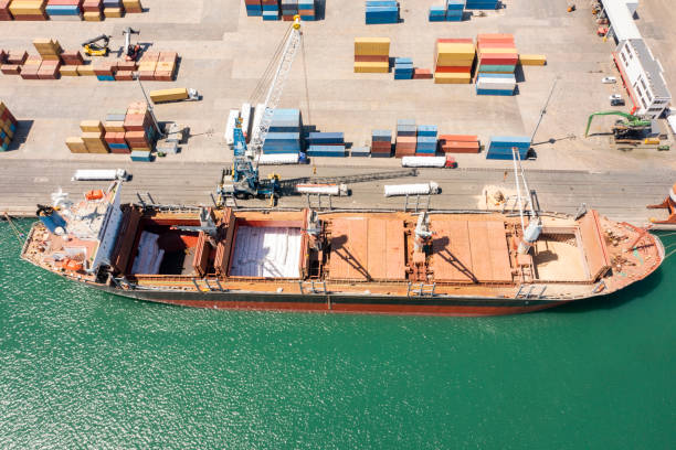 istock Aerial Flight Over Cargo Ship in Port 1325297992