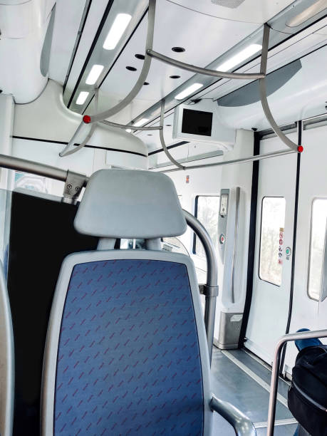 istock Interior inside in an empty carriage of the Barcelona train, seats, door for the exit.  T 1325298786