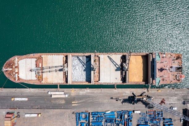 istock Aerial Flight Over Cargo Ship in Port 1325298880