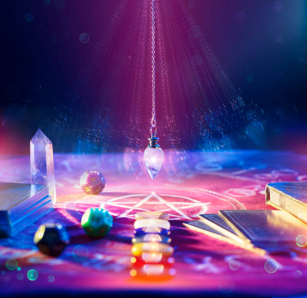Tarot - Pendulum On Altar - Fortune Teller Fortune Teller And Tarot - Pendulum On Altar With Defocused Cards And Chakra Stones crystal altar stock pictures, royalty-free photos & images