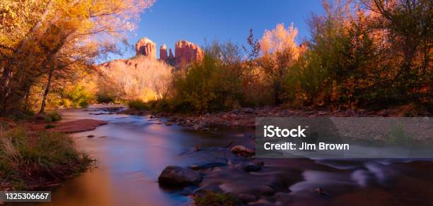 Sunset View Of Cathedral Rocks At Crescent Moon Picnic Area Autumn Colors Surround The River Stock Photo - Download Image Now