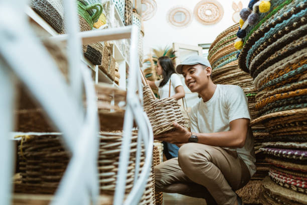 istock handsome male holding a woven basket bag 1325306948
