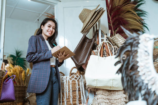 istock business woman in blazer write a notes when in a handicraft shop 1325307608