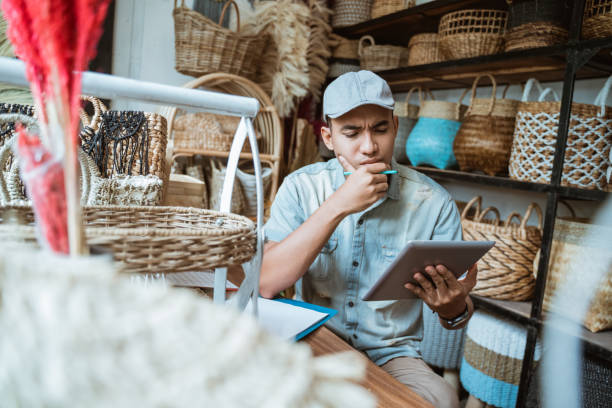 istock young entrepreneurs are anxious and hesitant to see a tablet screen 1325307620