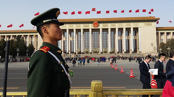 Beijing, China - 5 March 2016 :A People's Liberation Army Soldier stands guard in front of the Great Hall of the People