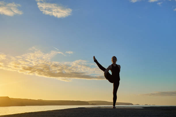 istock Advanced yoga posture in silhouette in a sunset 1325310311